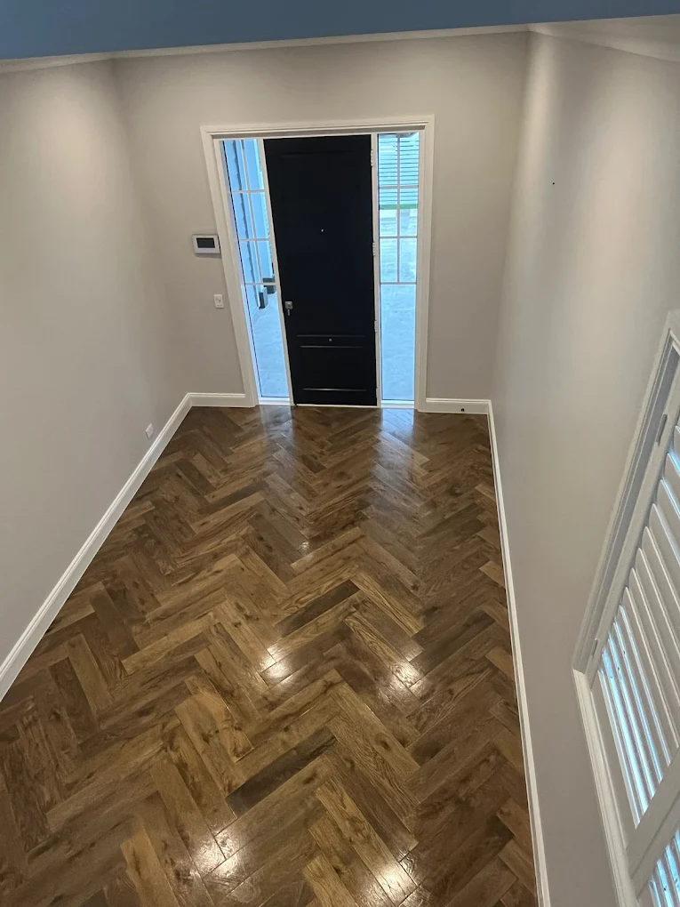 Herringbone hardwood entryway after clean