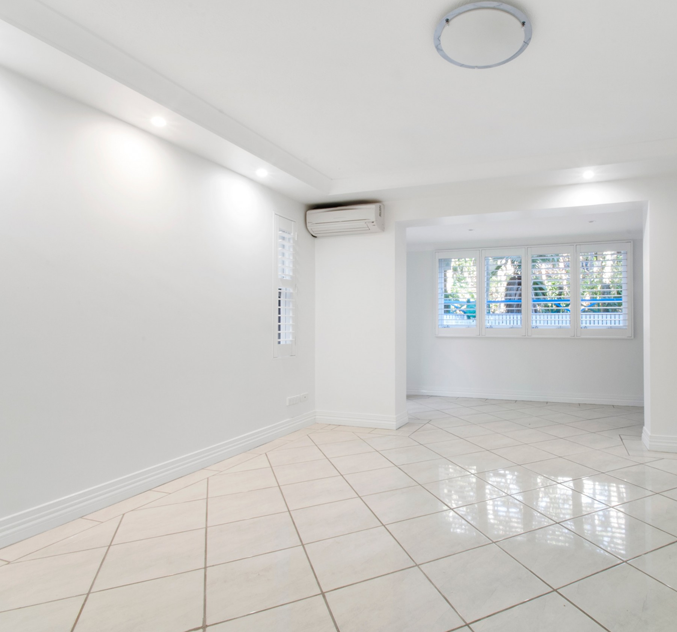 Tiled living room with plantation shutters