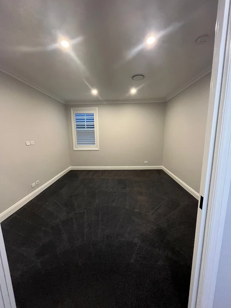Empty carpeted bedroom