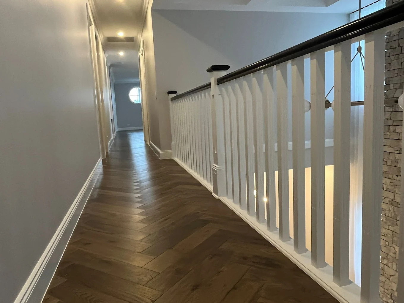 Hallway landing with stone wall